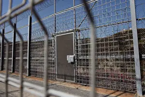 Migrant Prints: The border fence separating Spains northern enclave Ceuta and Morocco is seen from Ceuta