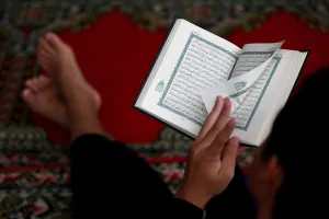 Religion Prints: A boy reads the Koran during the holy fasting month of Ramadan at a mosque in Jakarta