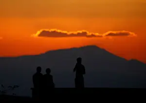Mideast Prints: Boys watch atop the roof of their house on the Turkish-Syrian border line in Reyhanli
