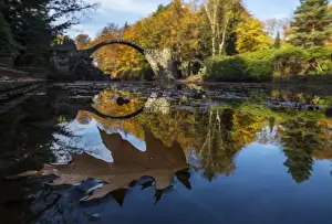 Landscapes Prints: The Bridge Rakotzbr?cke is pictured against trees in autumn colours in the the eastern