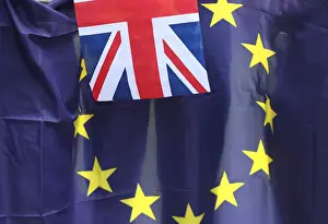 Prints of A British Union flag flies in front of an EU flag during a pro-EU referendum event at Parliament Square in London, Britain June 19, 2016. REUTERS/Neil Hall/File Photo TPX IMAGES OF THE DAY Britain Prints: A British Union flag flies in front of an EU flag during a pro-EU referendum event