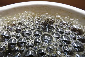 Bubbles form on the surface of a cup of coffee in a cafe in New York Bubbles form on the surface of a cup of coffee in a cafe in New York
