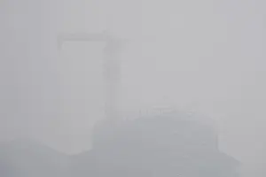 A building under construction is seen amid heavy smog in Beijings central business area