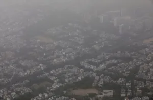 India Prints: Buildings are seen blanketed by haze and dust on the outskirts of New Delhi