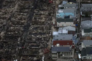 Burned houses are seen next to those which survived in Breezy Point after they were Burned houses are seen next to those which survived in Breezy Point after they were