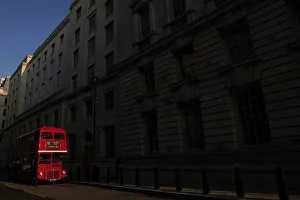 United Kingdom Prints: A bus is parked in a street in central London