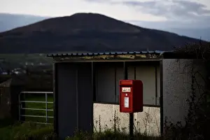 United Kingdom Prints: A bus-stop and red post box is seen in the border town of Jonesborough
