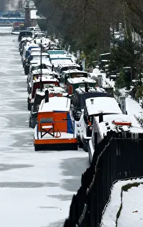 Britain Prints: Canal boats are frozen at their berths on the Regents Canal in Maida Vale in London
