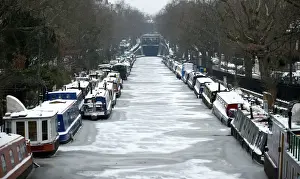 Britain Prints: Canal boats are frozen at their berths on the Regents Canal in Maida Vale in London