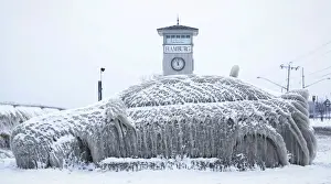 Weather Prints: A car covered with ice remains stranded on the waterfront in Hamburg, New York