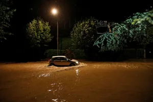 Swiss Prints: A car drives through water on the Quai d Ouchy after a flash flooding during a heavy rain