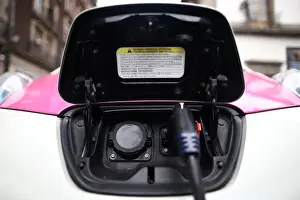Prints of A car is plugged in at a charging point for electric vehicles in Mexico City, Mexico, March 6, 2018. REUTERS/Edgard Garrido Global Prints: A car is plugged in at a charging point for electric vehicles in Mexico City