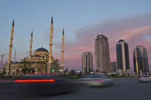 Europe Prints: Cars drive along Akhmad Kadyrov Avenue, with the Heart of Chechnya mosque and skyscrapers