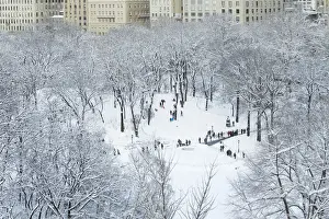 Weather Prints: Children sled on a hill inside of Central Park after a snowstorm in New York