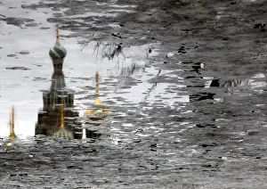 Prints of The Church of the Savior on Spilled Blood is reflected in melting ice on Arts Square in central St.Petersburg, March 20, 2012. The picture has been rotated 180 degrees Russia Prints: The Church of the Savior on Spilled Blood is reflected in melting ice on Arts Square in