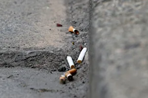 France Prints: Cigarette butts litter the street in Rochefort