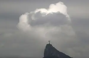 Clouds pass the Christ The Redeemer statue on Corcovado mountain, ahead of the Rio