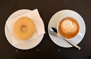 Food And Drink Prints: A coffee with milk and a donut are served in bakery in Vilassar de Dalt town