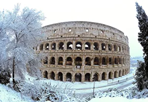Images Dated 26th February 2018: The Colosseum is seen during a heavy snowfall in Rome