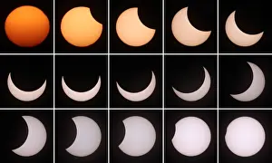 Austria Prints: A combination of photographs shows a partial solar eclipse in Vienna