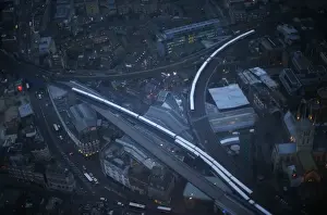 Commuter trains are seen at dusk in an aerial photograph from The View gallery at the Shard