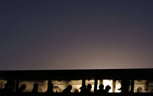 Commuters board a bus early in the morning near Howth in Dublin