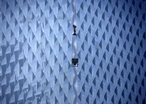 A crane is seen at a construction site for a new commercial building in Beijing