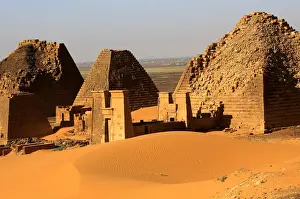 Sudan Prints: Creeping desert sands surround the Royal Cemeteries of Meroe Pyramids in Begrawiya