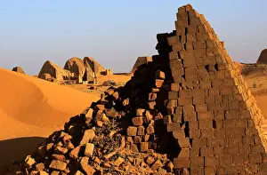 Sudan Prints: Creeping desert sands surround the Royal Cemeteries of Meroe Pyramids in Begrawiya