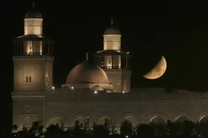 Celebration Prints: A crescent moon is seen next to the King Hussein Bin Talal Mosque in Amm