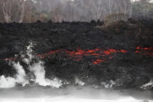 Prints of After crossing Highway 137, lava pours into the ocean during the eruption of the Kilauea Volcano near Pahoa, Hawaii, U.S. May 24, 2018. REUTERS/Marco Garcia Images Dated 2018 May: After crossing Highway 137, lava pours into the ocean during the eruption of the Kilauea