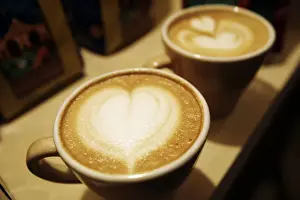 Cups of cappuccino sit on a table during the World Coffee Conference in Guatemala City