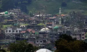 Philippines Prints: Damaged buildings and houses are seen as government troops continue their assault on its
