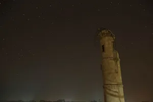 Mideast Prints: A damaged minaret is pictured at night in Aleppo, Syria