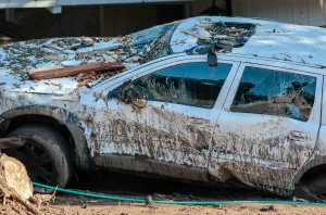 California Prints: A damaged vehicle is seen after a mudslide in Montecito