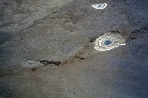Dams containing small amounts of water can be seen in a drought affected farming area