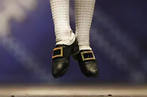 A dancers jumps in a heat during the All Scotland Championships in Irish Dancing