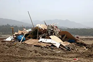 Peru Prints: Debris of huts are seen after police evict squatters from a land in Villa El Salvador