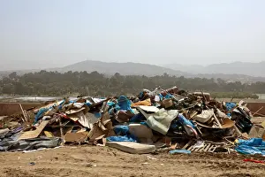 Peru Prints: Debris of huts are seen after police evict squatters from a land in Villa El Salvador