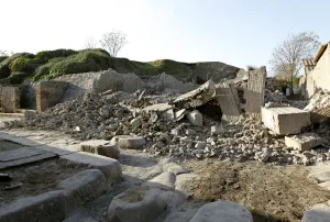 Italy Prints: Debris is seen after a house, once used by gladiators to train before combat