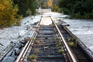 Debris swept downriver by the rising Tar River litter a flooded rail bridge crossing the Debris swept downriver by the rising Tar River litter a flooded rail bridge crossing the