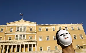 Greece Prints: A demonstrator wearing a mask protests in front of the parliament in Athens