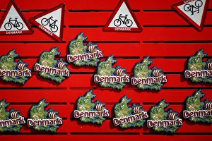 Denmark-themed fridge magnets are displayed for sale at a souvenir shop in Copenhagen