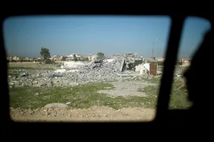 Mideast Prints: Destroyed house is seen through a car window in the eastern side of Mosul