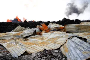 Hawaii Prints: A destroyed structure is seen as lava pours out of a fissure