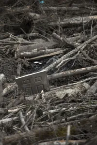 Mudslide Prints: A door is seen trapped amidst a debris field left by a mudslide in Oso