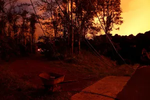 Hawaii Prints: Downed power lines and a wheelbarrow are seen by a dirt road
