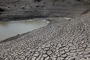 Dried mud is seen during a low-level period of water in Concepcion reservoir on