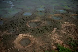 Climate Prints: A dry pond is pictured in a village of Menhai county