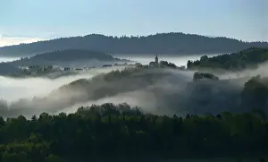 Early autumn morning fog is seen in the valleys near the village of Studencice
